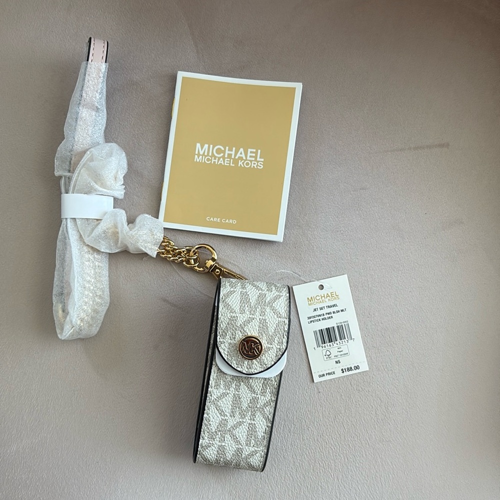 Michael Kors, jet set travel, lipstick holder powder blush, and gold strap.